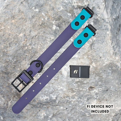 A purple and teal BioThane dog collar with specialty Fi links, and a Fi tracking device laid next to it. They are laid flat on a gray stone surface. Text in the corner reads 'FI DEVICE NOT INCLUDED'.