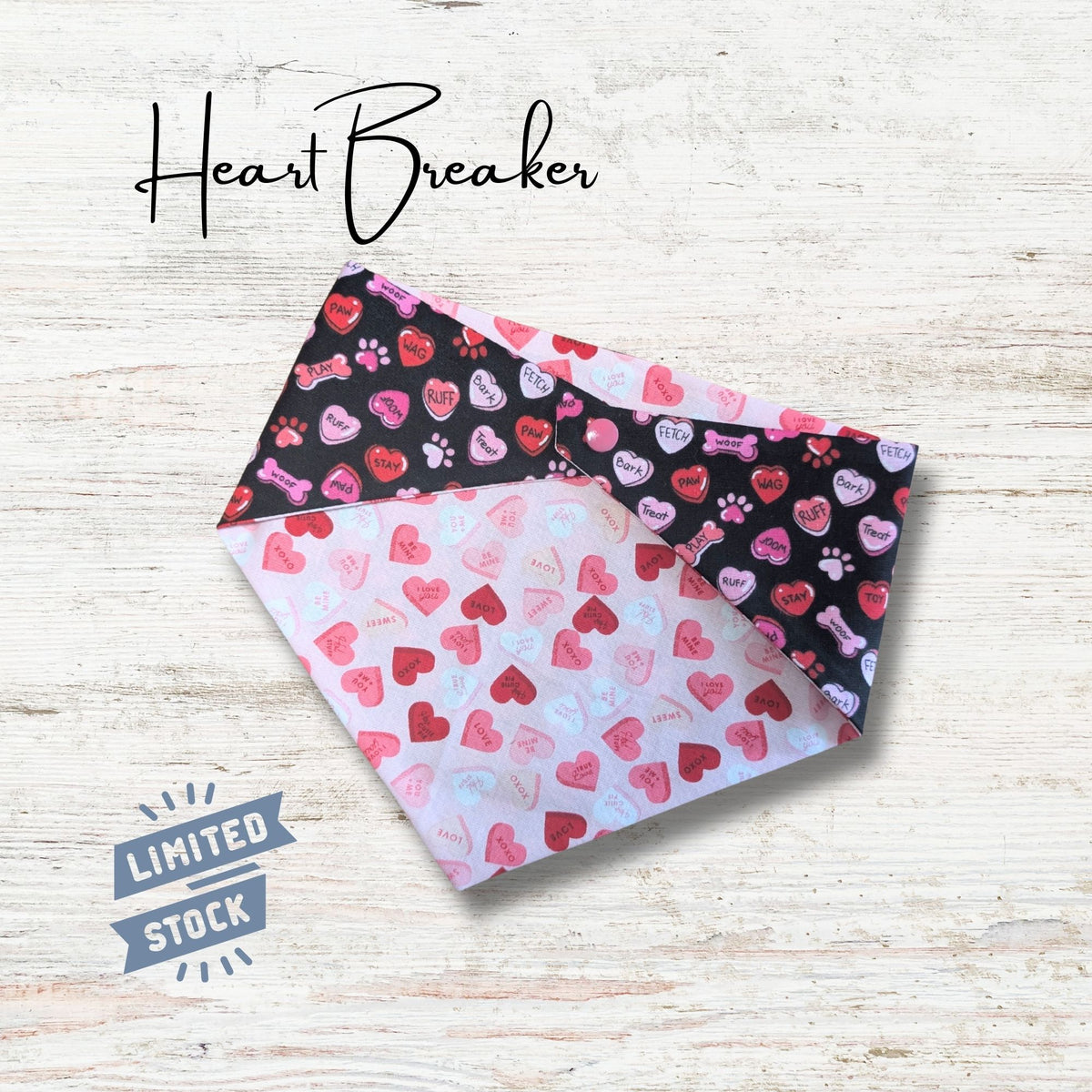 Heart-themed bandana with 'Heart Breaker' text and 'Limited Stock' label on a light wooden background. Pink and black are the main colors in the design