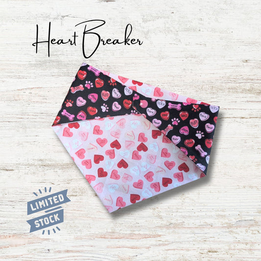 Heart-themed bandana with 'Heart Breaker' text and 'Limited Stock' label on a light wooden background. Pink and black are the main colors in the design