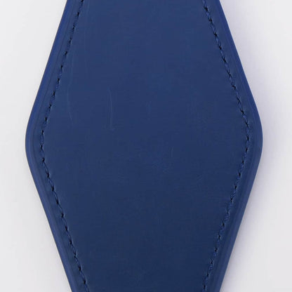 Blue keychain with a metallic ring on a white background