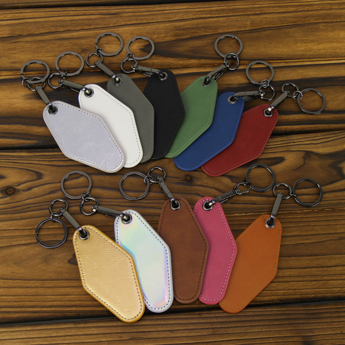 Set of colorful leather keychains on a wooden surface