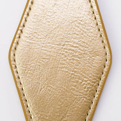 A gold-colored faux leather keychain with a stitched geometric shape, attached to a black metal split ring and key ring, shown on a plain white background.