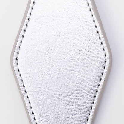 A silver faux-leather keychain tag with a textured finish, stitched edges, and a black metal clasp attached to a split key ring, shown on a plain white background.