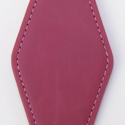 A magenta leather keychain tag with a stitched border, attached to a black metal clasp and a silver split key ring, shown on a plain white background.