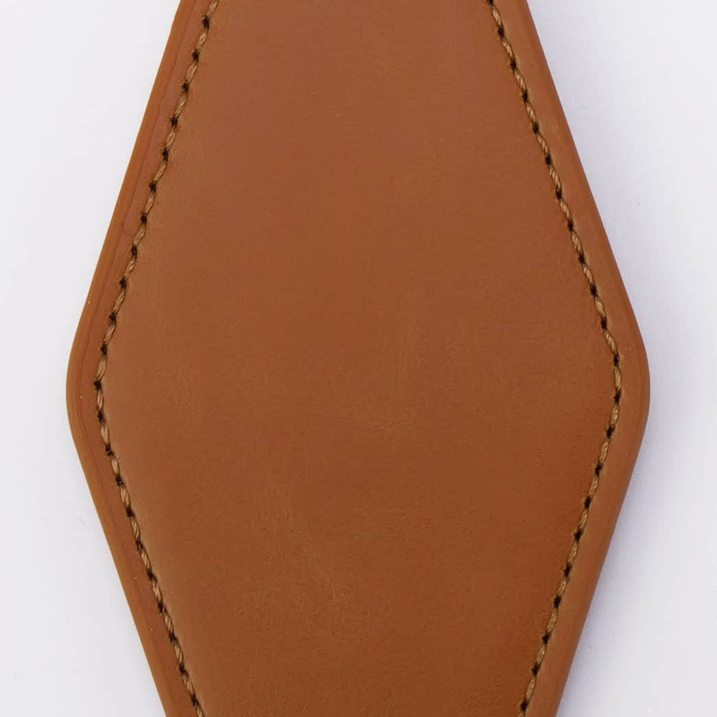Brown leather keychain with a metal ring on a white background