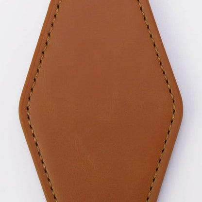 Brown leather keychain with a metal ring on a white background