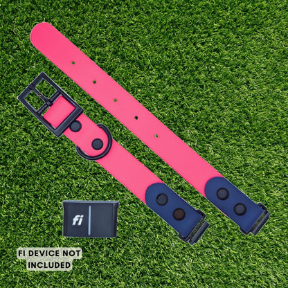 A bright pink dog collar with navy blue end sections and black hardware, laid flat on green grass. A small black FI device is shown separately, with text reading 'FI DEVICE NOT INCLUDED'.